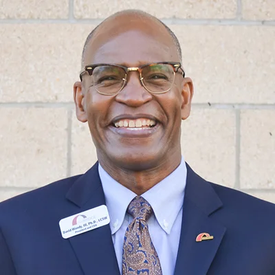 The Bridge leadership headshot of David Woody III, PhD. LCSW, President, and CEO.